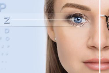 Model with half eyeglasses on and clear vision in the other eye after improved eyesight from lasik surgery near me