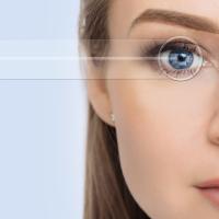 Model with half eyeglasses on and clear vision in the other eye after improved eyesight from lasik surgery near me